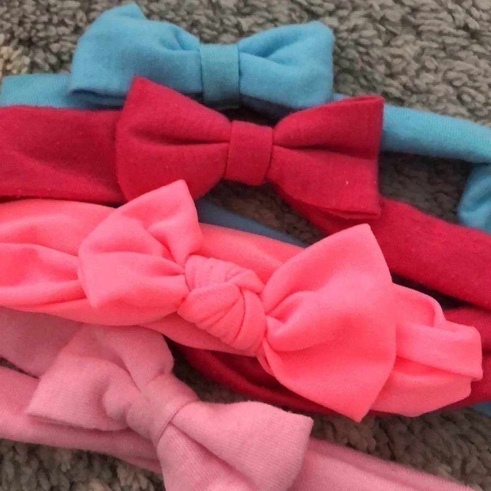 Everyday wear mini cloth bow set of four in blue, pink, red, and coral